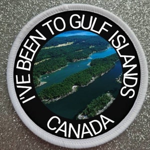 May include: A white and black round patch with the text "I've Been To Gulf Islands Canada" and a photo of a body of water with islands in the background.