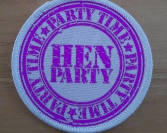 May include: A white circular patch with a purple border and the text "HEN PARTY" in the center. The border is a repeating pattern of "PARTY TIME" with a star between each word.