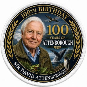 May include: A circular embroidered patch featuring a portrait of Sir David Attenborough. The design includes the text 100TH BIRTHDAY, 100 YEARS OF ATTENBOROUGH, and SIR DAVID ATTENBOROUGH. Imagery includes a green frog, a whale, a penguin, and a bird.