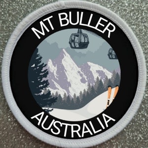 May include: White round patch with black border and text "MT BULLER AUSTRALIA". Inside the border is a black and white illustration of a snowy mountain scene with ski lifts and skiers.