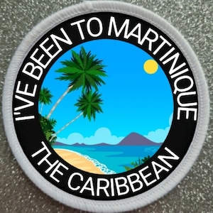 May include: A white round patch with black text that reads "I've Been To Martinique The Caribbean" with a cartoon image of a beach scene with palm trees, a blue ocean, and a yellow sun.