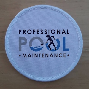May include: White round patch with a blue and gray logo that says "Professional Pool Maintenance". The logo features a stick figure holding a net and a wave.