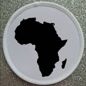 May include: White fabric patch with a black outline of the continent of Africa.