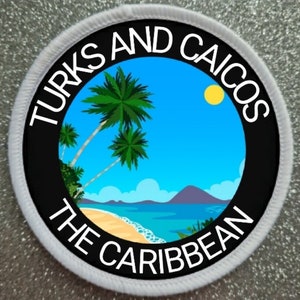 May include: A white circular patch with black text that reads "Turks and Caicos The Caribbean". The patch features a cartoon image of a beach scene with palm trees, a blue sky, and a yellow sun.