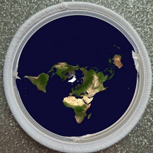 May include: A flat earth map with a white border, showing the continents of the world on a blue background.