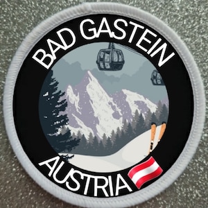 Könnte beinhalten: Ein runder weißer und schwarzer Patch mit dem Text "Bad Gastein Austria" und einer Darstellung einer verschneiten Berglandschaft mit einer Gondel und Skiern.