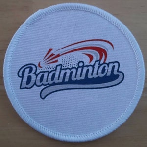 May include: White round fabric patch with a blue, red, and gray badminton shuttlecock design and the word "Badminton" in a blue and white script font.