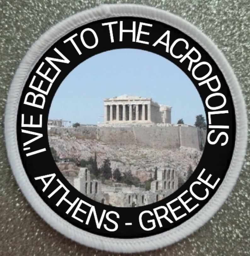 May include: A white round patch with black text that reads "I've Been To The Acropolis Athens - Greece". The patch features a photo of the Acropolis in Athens, Greece.