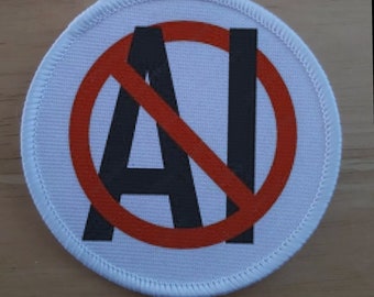 Odznaka z napisem „Anti Artificial Intelligence Ban AI”