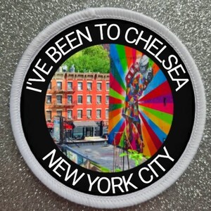 May include: A white round patch with black text that reads "I've Been To Chelsea New York City". The patch features a colourful image of a building and a mural.