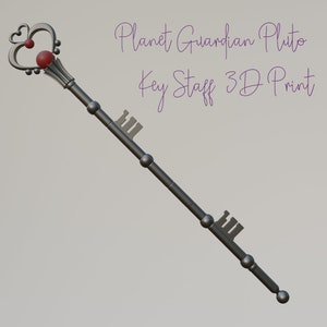 May include: A 3D-printed key staff with a heart-shaped top and a red orb. The staff is dark gray with key-shaped details and the text "Planet Guardian Pluto Key Staff 3D Print".