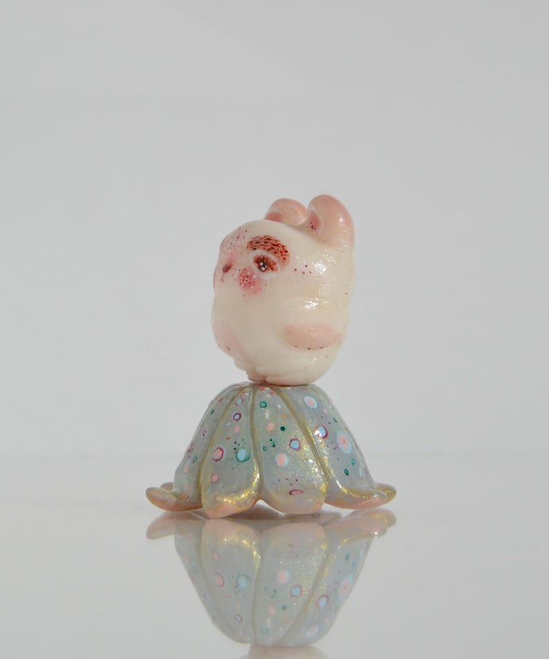 Little Cute Teddy Bear With Bushy Eyebrows Standing on a Calyx