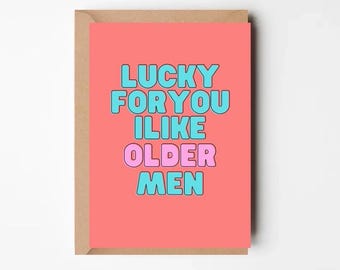 May include: A pink and blue greeting card with the text "LUCKY FOR YOU I LIKE OLDER MEN" on a coral background.