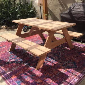 6 Foot Long Picnic Table, with Attached Benches, built with Douglas Fir wood.