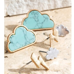 May include: Set of four gold and silver stud earrings featuring turquoise and silver cloud designs and lightning bolt designs.