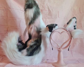 Pastelroze puppyoren en staart