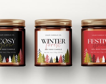 May include: Three glass candle jars with gold lids and labels. The labels are red, black and white with gold lettering. The candles are labelled "Cosy Glow", "Winter Forest", and "Festive Spice". Each candle is a soy wax candle and weighs 4 oz (113g).