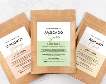 May include: Three brown paper pouches with white labels containing bath soaks. The labels have the text "Your Skincare Co." and the names of the bath soaks: "Coconut Mango", "Avocado Shea", and "Almond Cocoa".