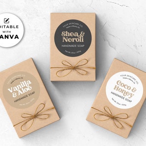 May include: Three brown cardboard boxes with twine bows. Each box has a round sticker with white text on a colored background. The stickers say "Shea & Neroli", "Vanilla & Aloe", and "Coco & Honey". All three boxes say "Handmade Soap" and "Your Skincare Co."