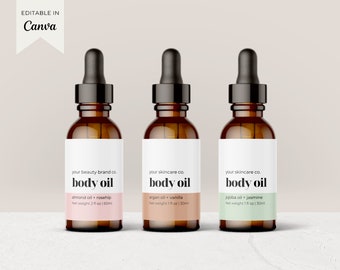 May include: Three amber glass bottles with dropper tops and white labels. The labels have black text that reads "your beauty brand co. body oil almond oil + rosehip Net weight 2 fl oz | 60ml", "your skincare co. body oil argan oil + vanilla Net weight 1 fl oz | 30ml", and "your skincare co. body oil jojoba oil + jasmine Net weight 1 fl oz | 30ml".