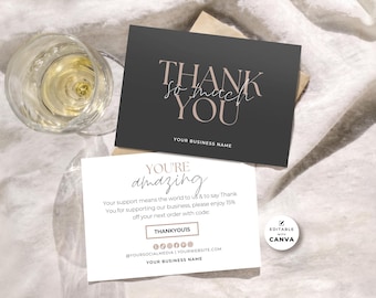 May include: Two rectangular business cards. One is dark gray with the text THANK SO MUCH YOU and YOUR BUSINESS NAME. The other is white with the text YOU'RE amazing, a discount code THANKYOU15, and social media icons. A small round sticker says EDITABLE WITH CANVA.