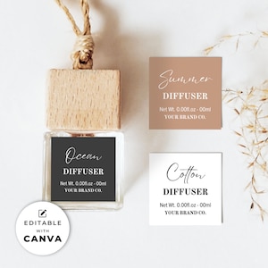 Puede incluir: Tres etiquetas imprimibles para difusores de coche. Las etiquetas son blancas con texto negro y presentan las palabras "Ocean", "Summer" y "Cotton" con la palabra "Diffuser" debajo. Cada etiqueta también incluye el texto "Net Wt. 0.00fl.oz - 00ml" y "YOUR BRAND CO."