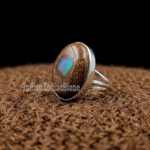 May include: A rustic wooden sign with the text "Welcome to our home" in white lettering. The sign features a distressed finish and a simple, inviting design, perfect for front door decor.