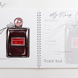 May include: A white notebook with a spiral binding. The left page features a hand-drawn illustration of a dark red perfume bottle with a pink cap and a red label that says "EAU DE PARFUM Love is..." The right page has the text "My Plans" and "Thank You!" written in black ink.