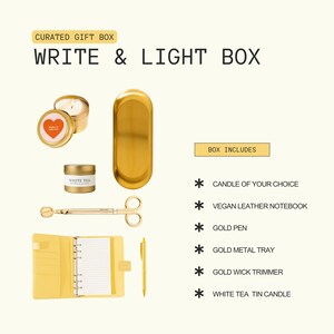 The image is a gift box containing various items, including a candle, a notebook, a pen, a stapler, and a pair of scissors.