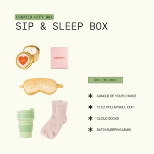 The image is a curated gift box containing various items, including a candle, a sleep mask, a cup, and a pair of socks.
