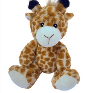 May include: A soft giraffe toy with a brown and cream spotted pattern. The giraffe has a white muzzle, black eyes, and small black ears. The plush toy is sitting with its legs extended.
