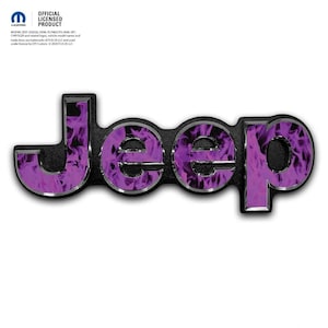 May include: A black Jeep emblem with a purple flame design. The word "Jeep" is in capital letters with a silver outline. The background is black and textured. The official licensed product logo is in the top left corner.