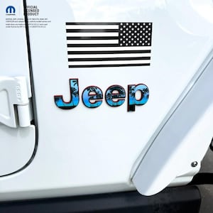 May include: White vehicle door with a black and white American flag sticker and a "Jeep" emblem. The emblem has a blue and green tropical scene with a red outline. The text "OFFICIAL LICENSED PRODUCT" is visible.