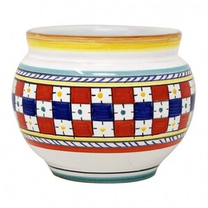 May include: White ceramic planter with a red, blue and yellow geometric pattern. The planter has a rounded shape and a wide rim.
