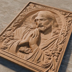 May include: A wooden carving of Jesus Christ with his hands clasped in prayer. The carving is detailed and realistic, with a halo around Jesus' head. The carving is framed with a decorative border.