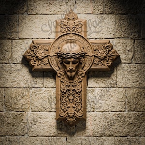 May include: A wooden cross with intricate carvings, featuring a detailed relief of Jesus Christ's face with a crown of thorns. The cross is mounted on a brick wall.