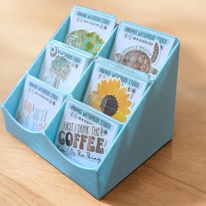 3d printed display stand for art prints, custom 3 inch sticker display, organizer for desk, small business display stands, art show display