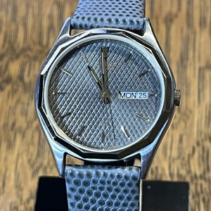 Vintage Citizen Two Tone Day/Date watch with a gray textured dial and strap. - Model  1102-K11294-CKK