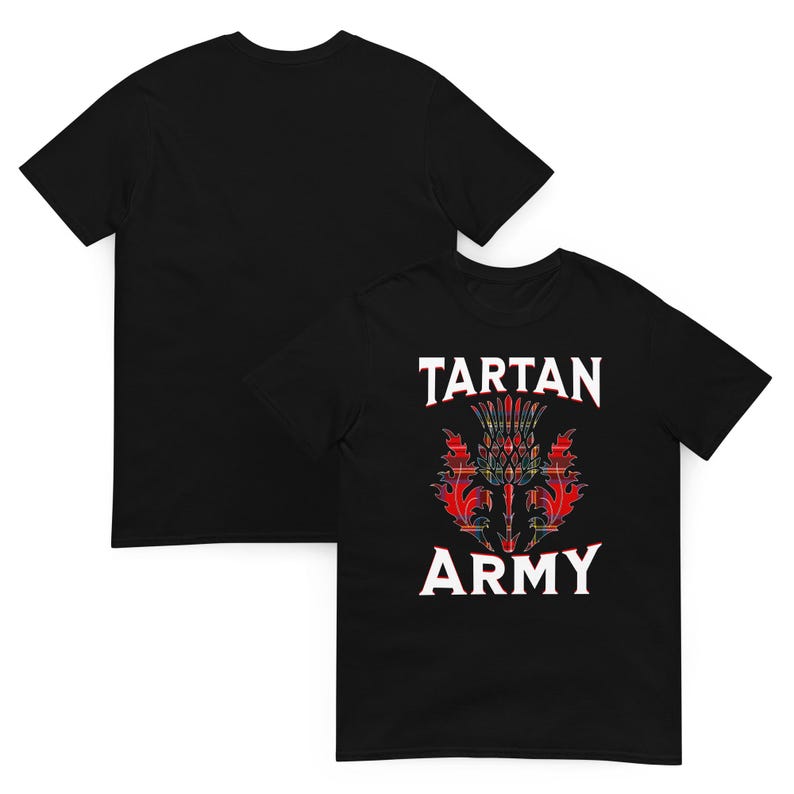 May include: Black t-shirt with the text "TARTAN ARMY" and a thistle design in red, green, and yellow tartan. The shirt is displayed with a second black t-shirt in the background.