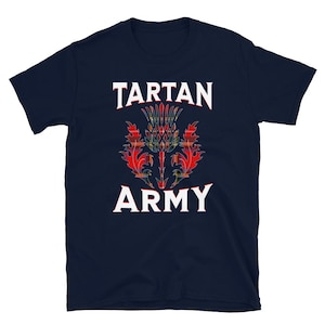 May include: Navy blue t-shirt featuring the text "TARTAN ARMY" in white, with a colorful thistle design in the center. The thistle design incorporates red, green, and yellow tartan patterns, creating a bold and eye-catching graphic.