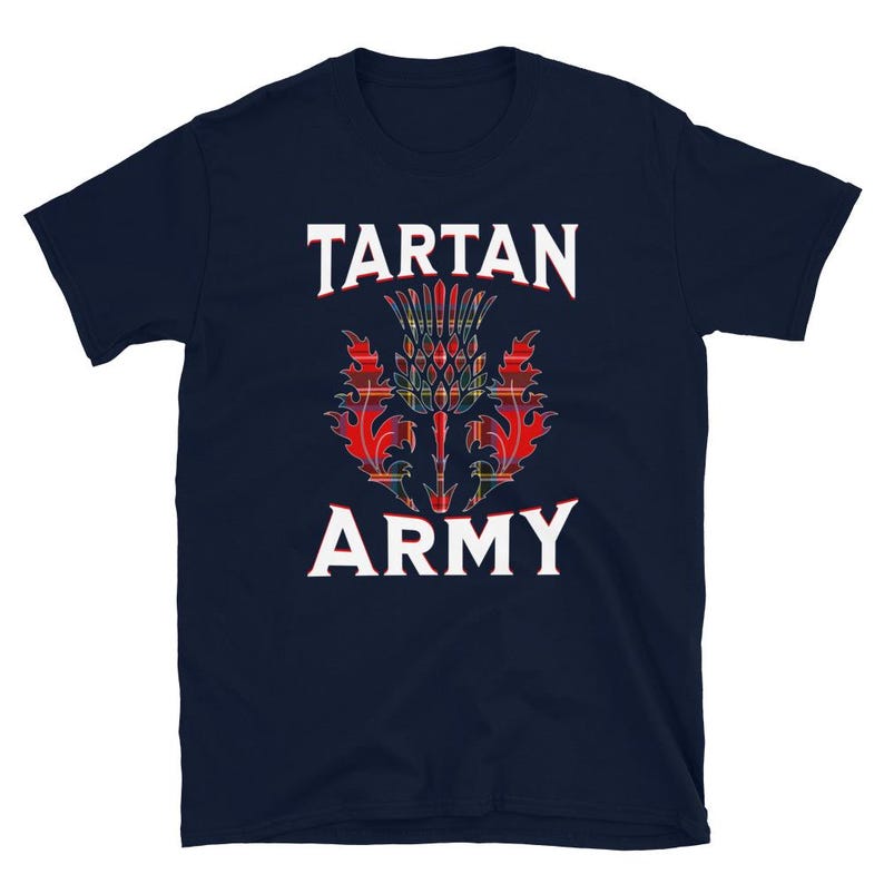 May include: Navy blue t-shirt featuring the text "TARTAN ARMY" in white, with a colorful thistle design in the center. The thistle design incorporates red, green, and yellow tartan patterns, creating a bold and eye-catching graphic.