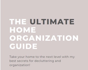 May include: A home organization guide with the title "THE ULTIMATE HOME ORGANIZATION GUIDE" in large white and gray text. The guide promises secrets for decluttering and organization. The website address is www.spacesbyemily.com.