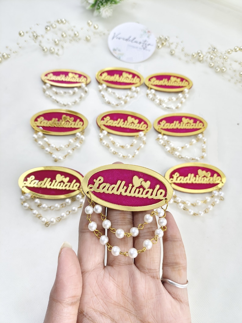 Latest Ladkiwale wedding brooches adorned with delicate pearl chains, perfect for bridal party accessories. These beautiful brooches make an ideal gift for bridesmaids and add a touch of sophistication to any Indian wedding ceremony.