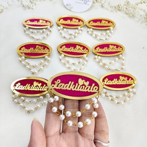 Exclusive Ladkiwale brooches with pearls, ideal for weddings and marriage celebrations. These elegant pins are perfect for bridesmaids and add a luxurious touch to bridal attire.