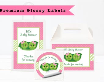 May include: Pink and white baby shower labels and gift boxes. The labels and boxes feature a green pea pod with smiling faces and pink bows. Text includes "Jill's Baby Shower" and "Thanks for coming!"