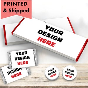 May include: A set of personalized chocolate bar wrappers and round candy wrappers. The wrappers are white with red trim and feature the text "Your Design Here".