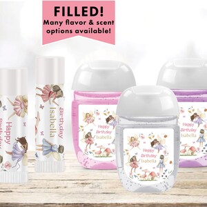 May include: Four small bottles of hand sanitizer with labels featuring a fairy theme. The labels are decorated with pink, purple, and green flowers and butterflies. The text on the labels reads "Happy Birthday Isabella".