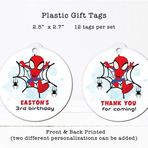 a pair of plastic tags with a spider on them