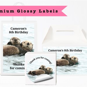 May include: White gift bags and boxes with labels featuring sea otters in water. Text on the labels reads "Cameron's 8th Birthday" and "Thanks for coming!" The top of the image has the text "Premium Glossy Labels".