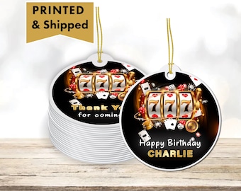 May include: Round, black and gold favor tags with a slot machine graphic and the text "Thank you for coming" and "Happy Birthday CHARLIE".